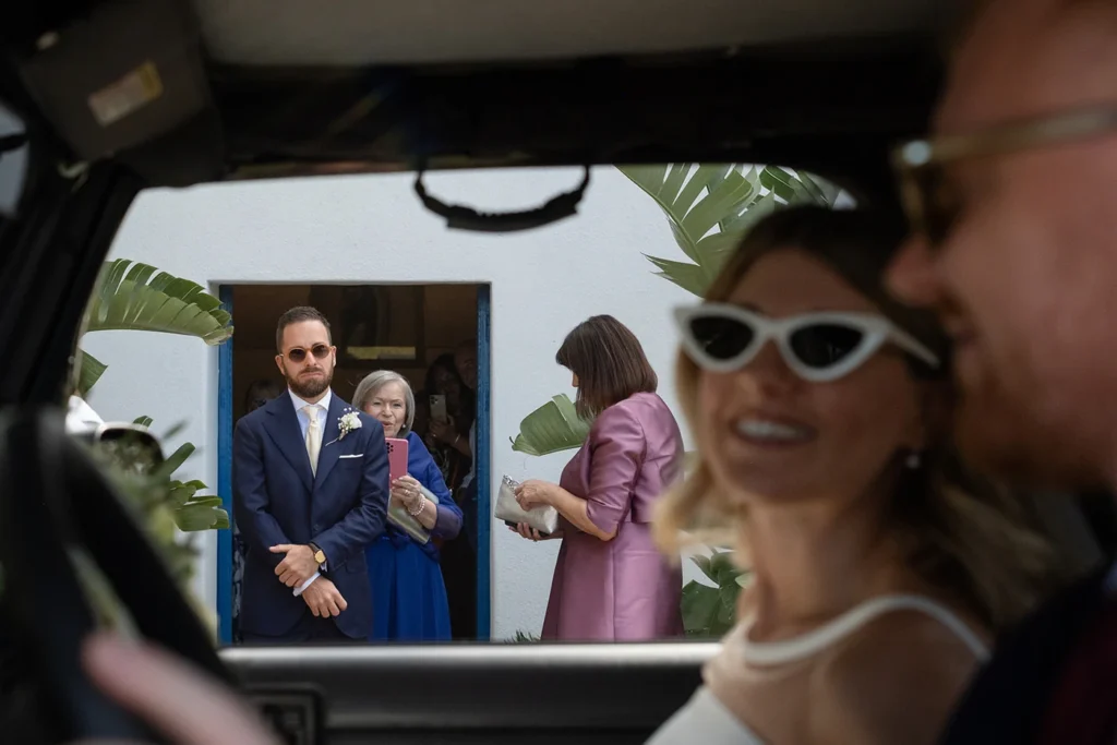 Groom becoming emotional as the bride arrives at the Church of Saint Anthony in Mueggen, Pantelleria.