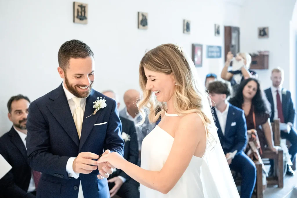 Wedding vows inside the Church of Saint Anthony in Mueggen, Pantelleria.