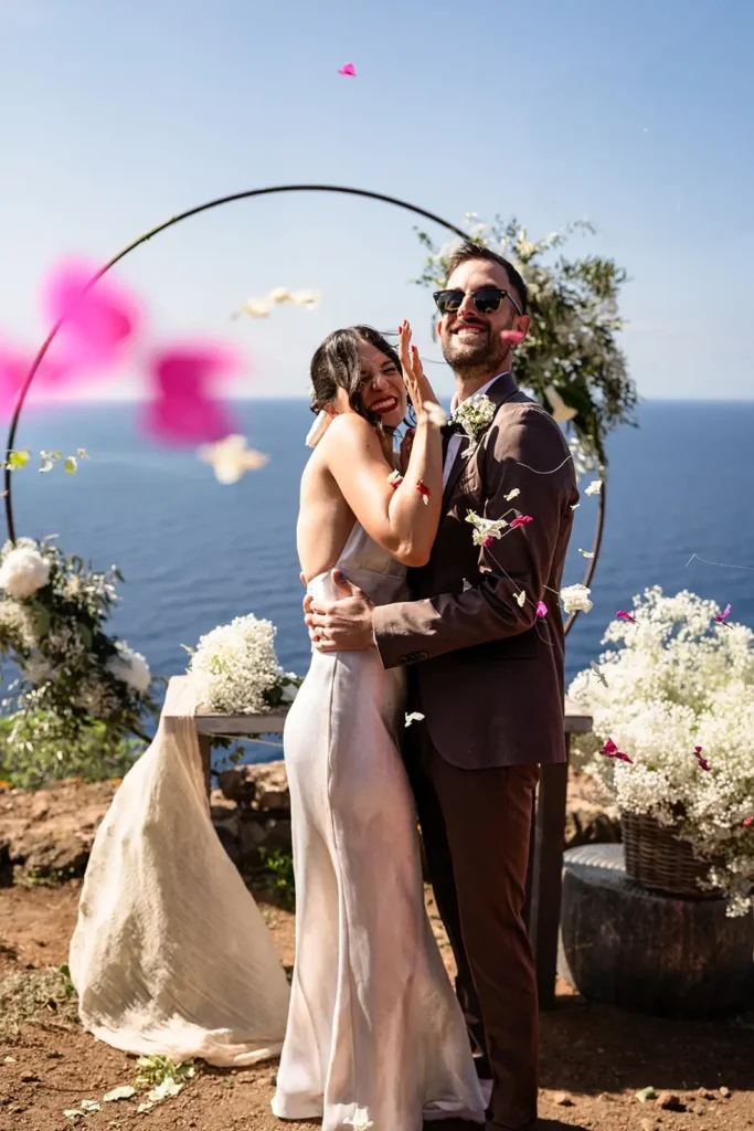 Guests throwing petals after a wedding ceremony at Dammare in Pantelleria.