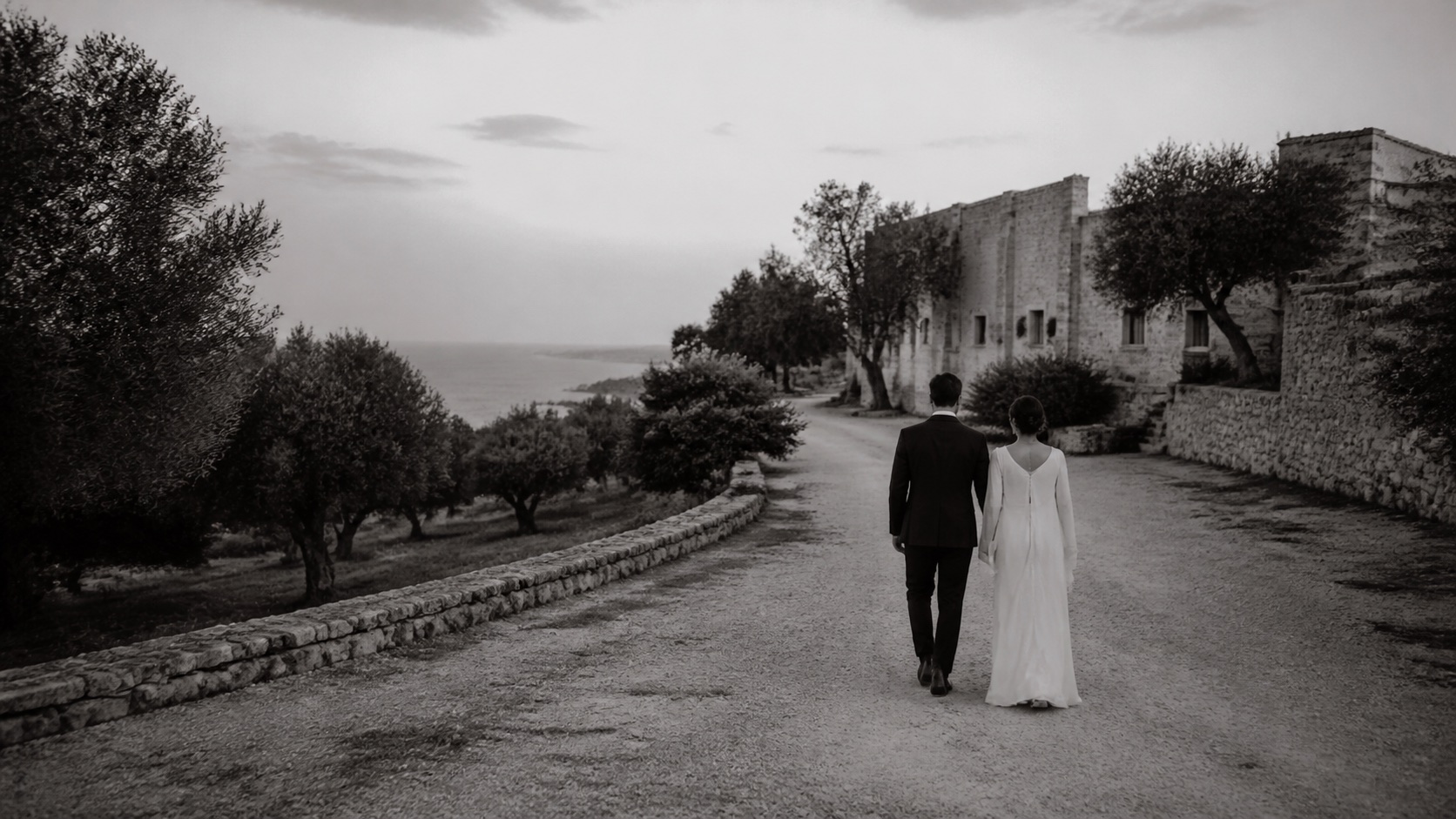 Private wedding couple walking through a secluded Sicilian estate
