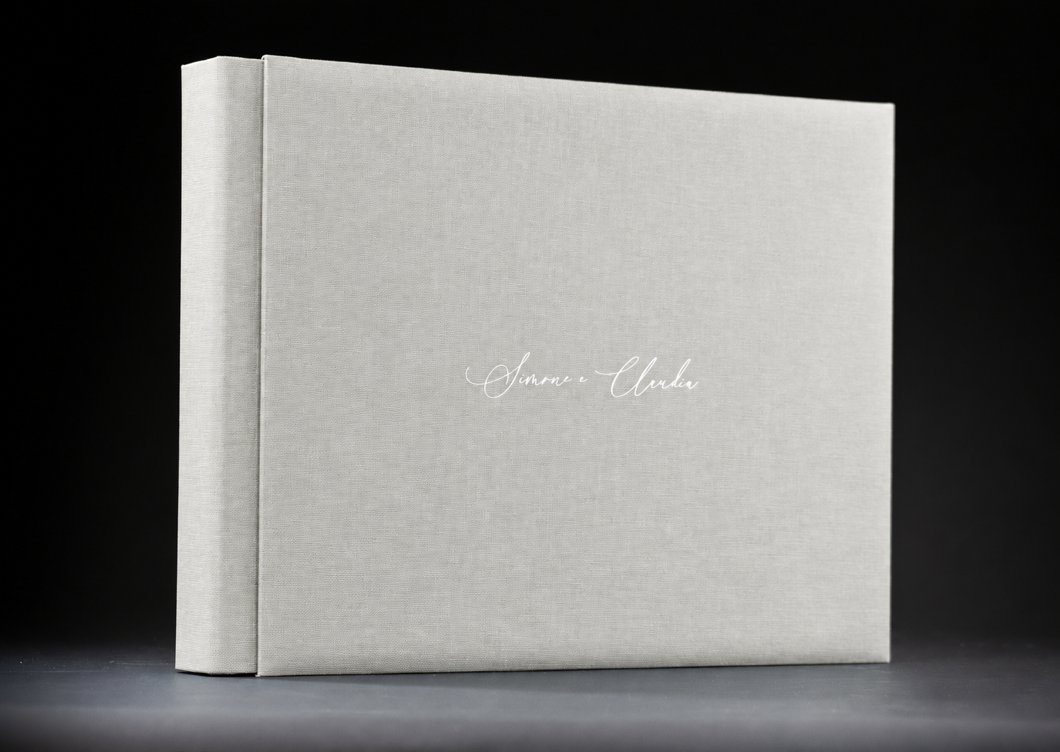 Basic wedding album with a light linen-grey cover and personalised white lettering.